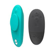 Load image into Gallery viewer, The We-Vibe Moxie+ Plus in Aqua is shown on a plain white background. The bullet vibrator is displayed next to the remote control.