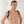 Load image into Gallery viewer, A shirtless blonde man is shown from the chest up, standing in front of a white wall. He wears The Contender Leather BDSM Chest Harness. The black straps wrap over his shoulders.
