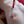 Load image into Gallery viewer, A close-up of a woman’s bare chest is shown. The Colt Muscle Nips Pumps is on her nipple, which is seen larger and being sucked into the tube. The red hose coming out of the cylinder has a white valve.
