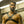 Load image into Gallery viewer, A brunette man with facial hair is shown from the waist up, standing in an industrial room. He wears the black Leather Chest. A strap goes over each shoulder and under his arms. They are attached in the middle to a metal O-ring.
