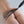 Load image into Gallery viewer, A close-up of a nude woman’s ass with the falls of the Kinklab Electro-Whip Neon Wand® Attachment being dragged over it is shown against a white background. The falls are thin and black with a silver base and are attached to the Neon Wand.
