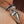 Load image into Gallery viewer, A close-up of a man’s bare butt with the Electrastim Electro Butt Plug resting on top.
